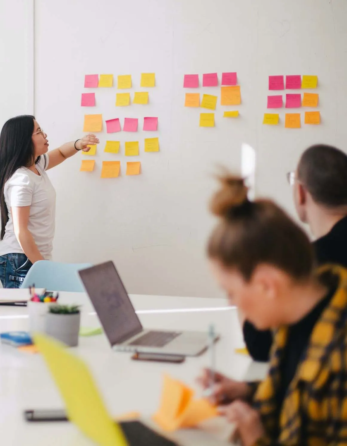 Group using sticky notes in a meeting